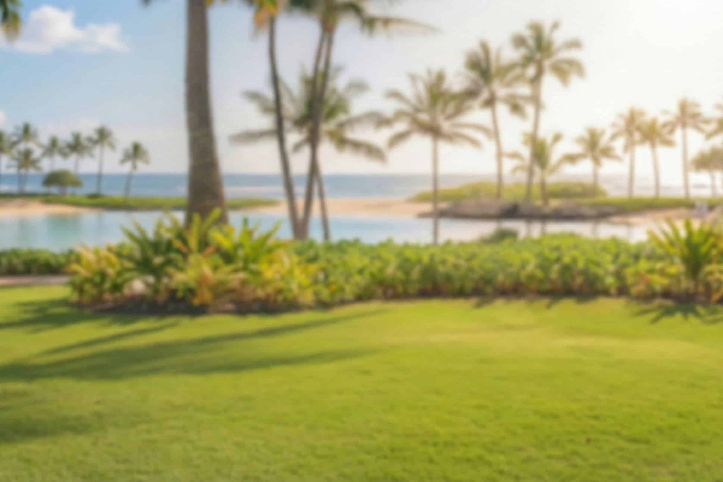 Oceanfront golf course property in Kona with lush landscaping and tropical scenery.