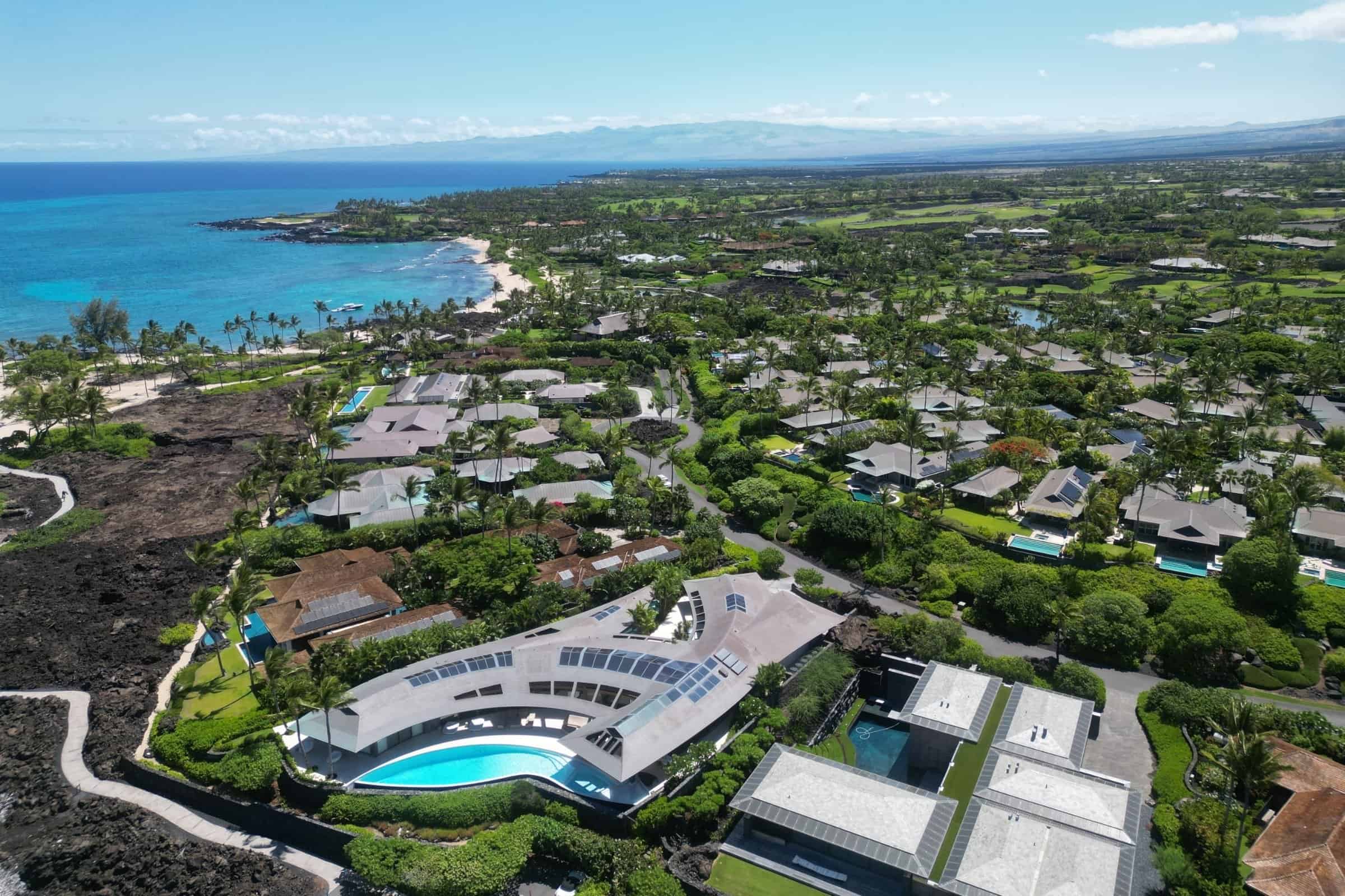 Aerial of the oceanfront homes and bay at Kukio on the North Kona coast.