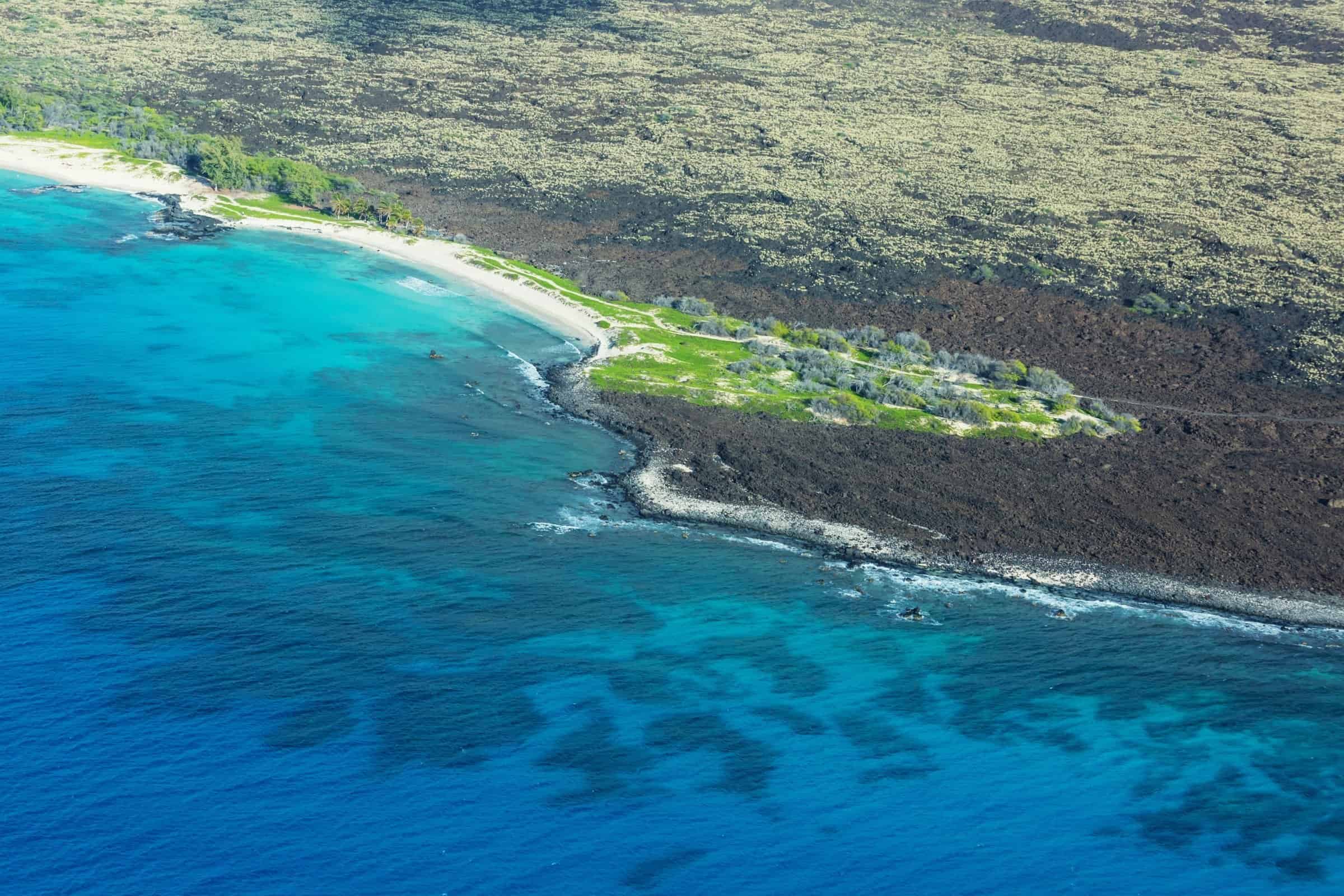 Aerial view of Big Island Hawaii coastline showcasing luxury oceanfront property near Kona.