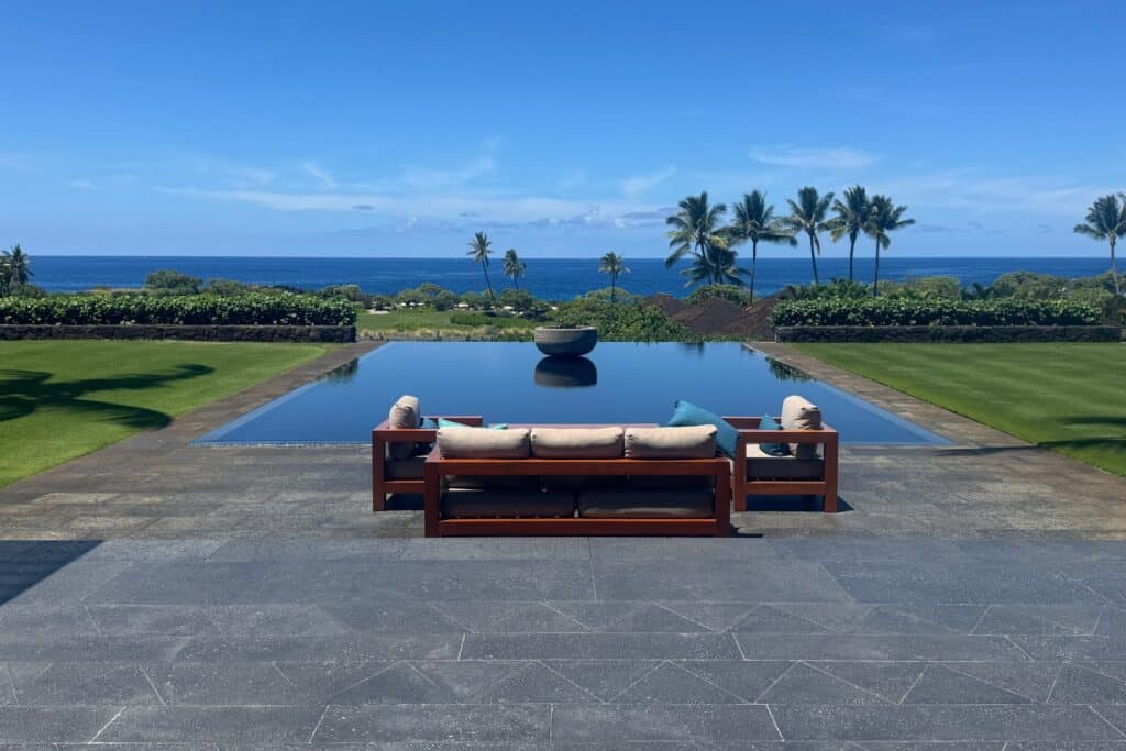 Stunning Big Island Hawaii estate with infinity pool, ocean views, and tropical landscaping near Kon.