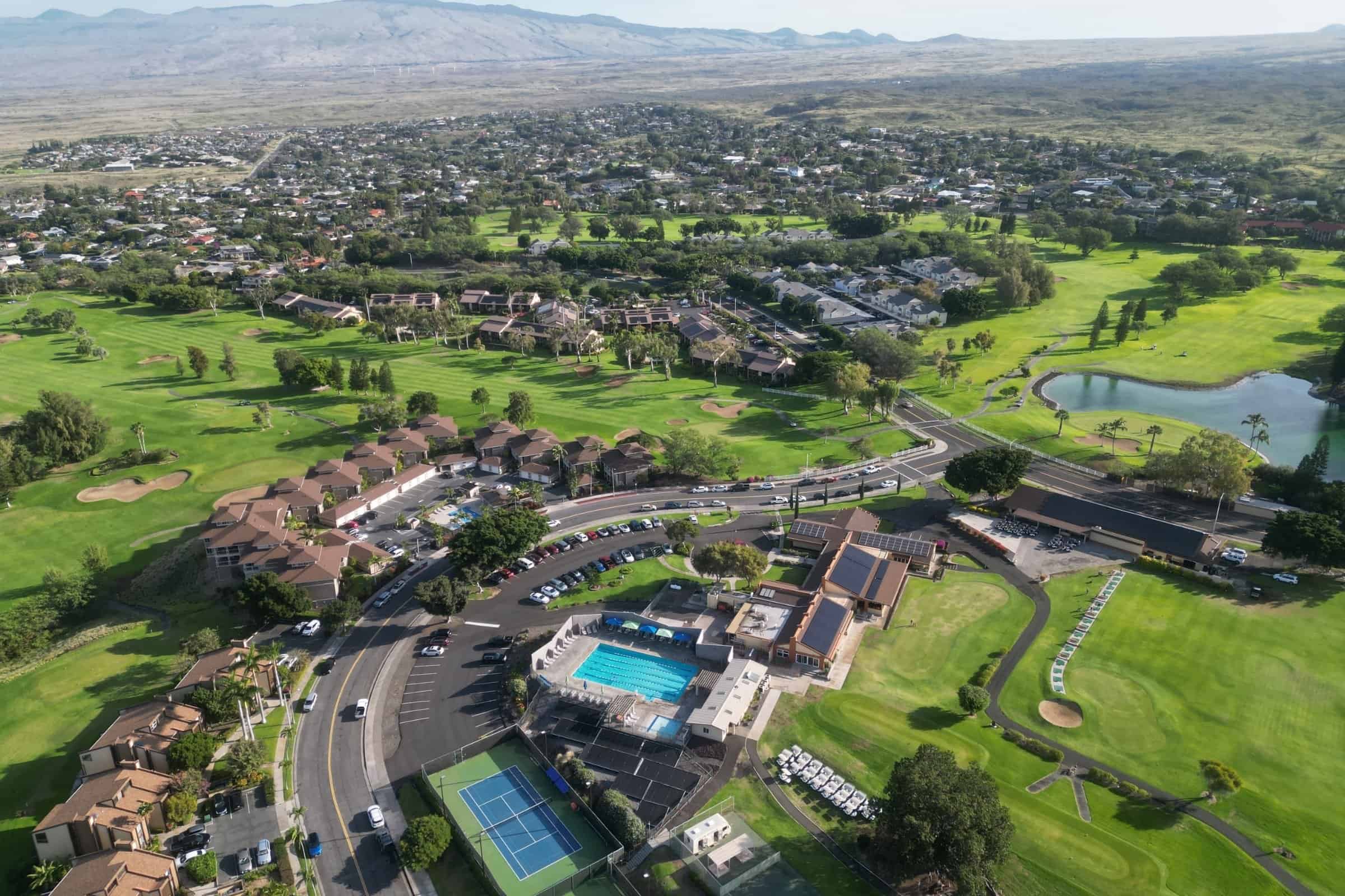 Luxury golf course home in Kona with ocean views and resort amenities.