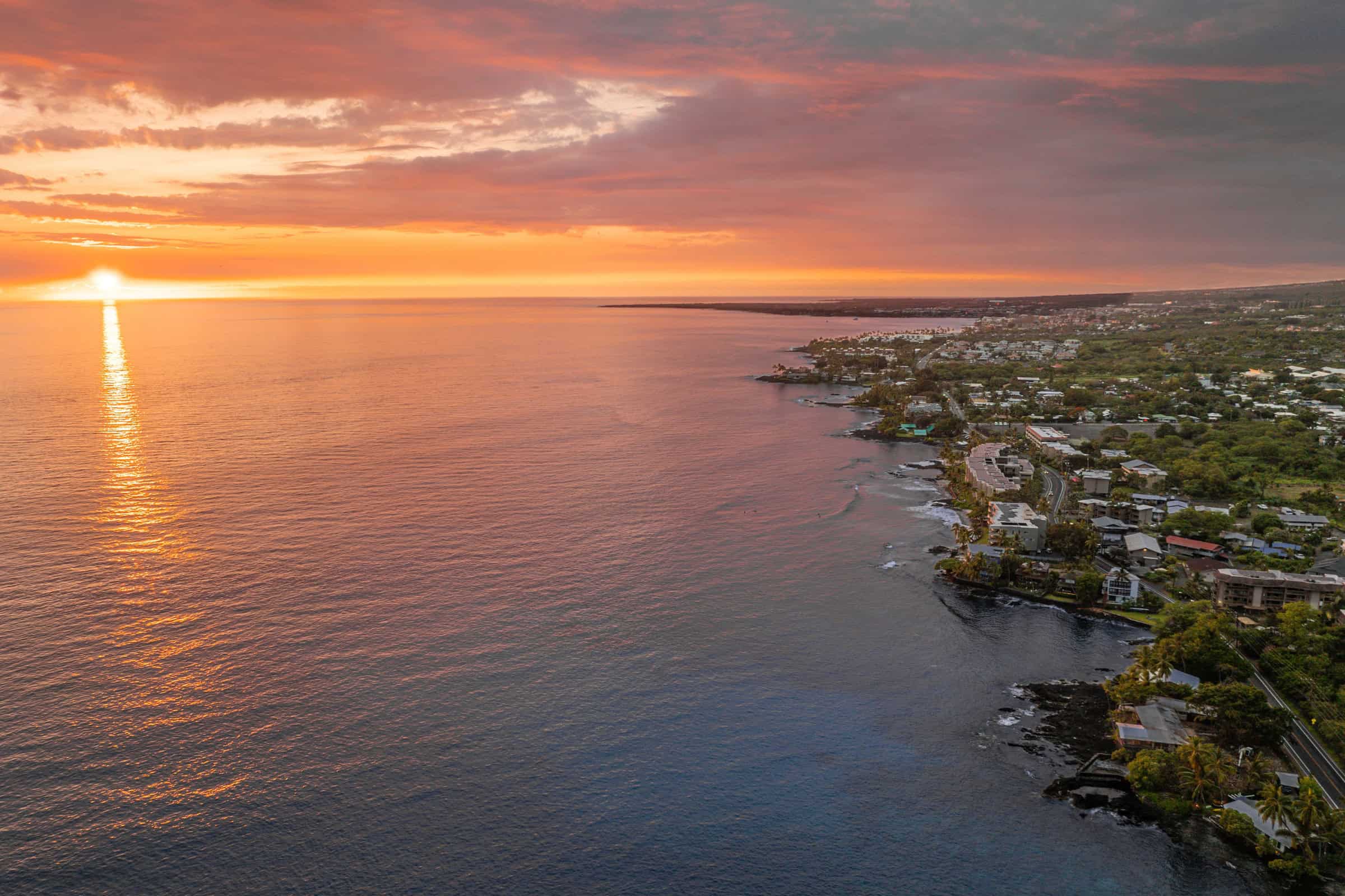 Luxury oceanfront property in Kona with stunning sunset views and resort-style amenities.