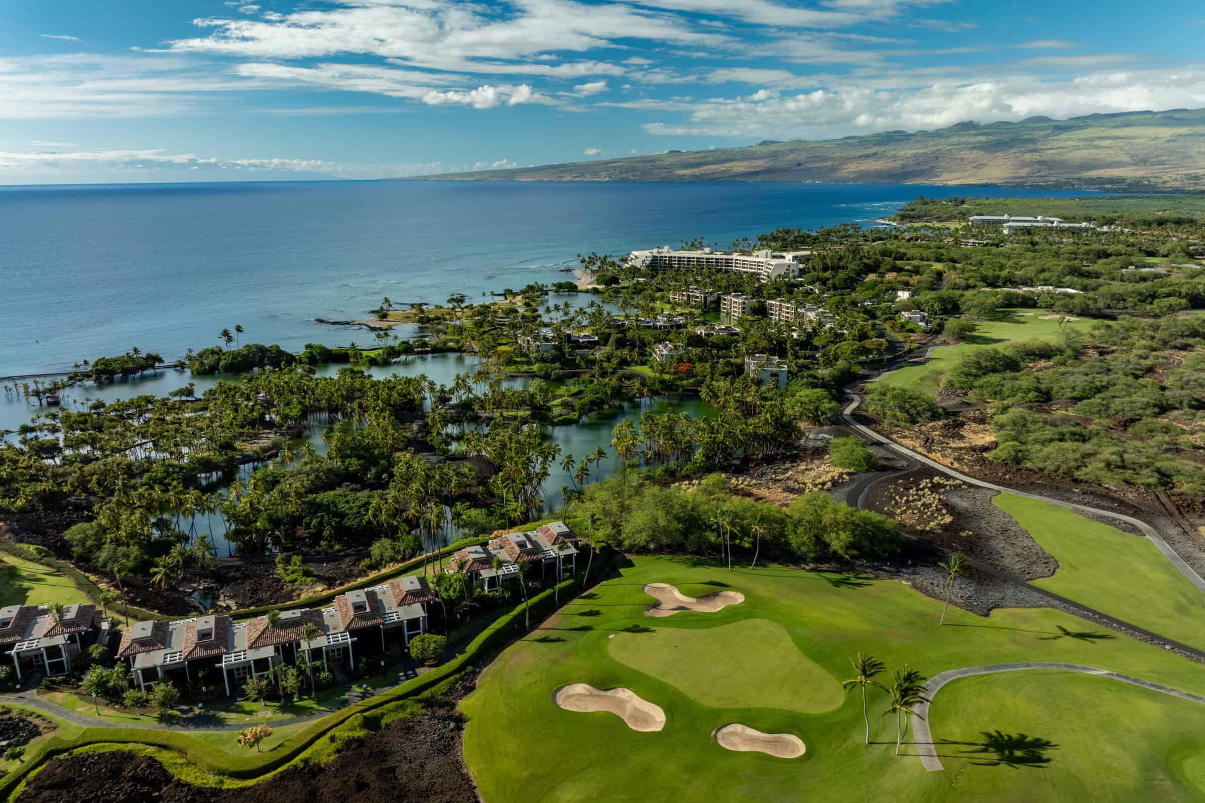 Luxury oceanfront golf course property in Kona, Big Island Hawaii with resort amenities.