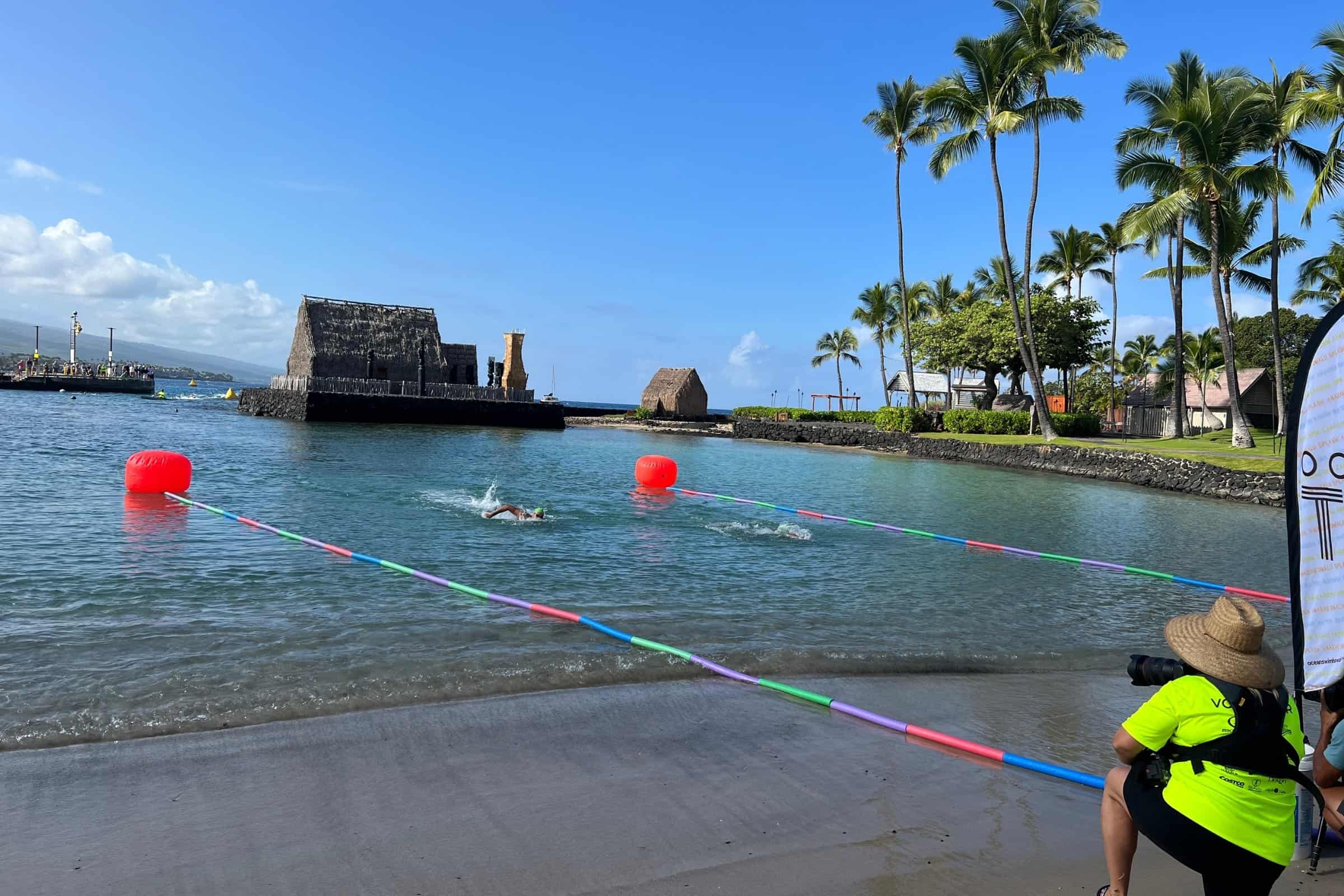 Buoy line marking the swim course at Kamakahonu with Ahuena Heiau on the point in Kailua-Kona.