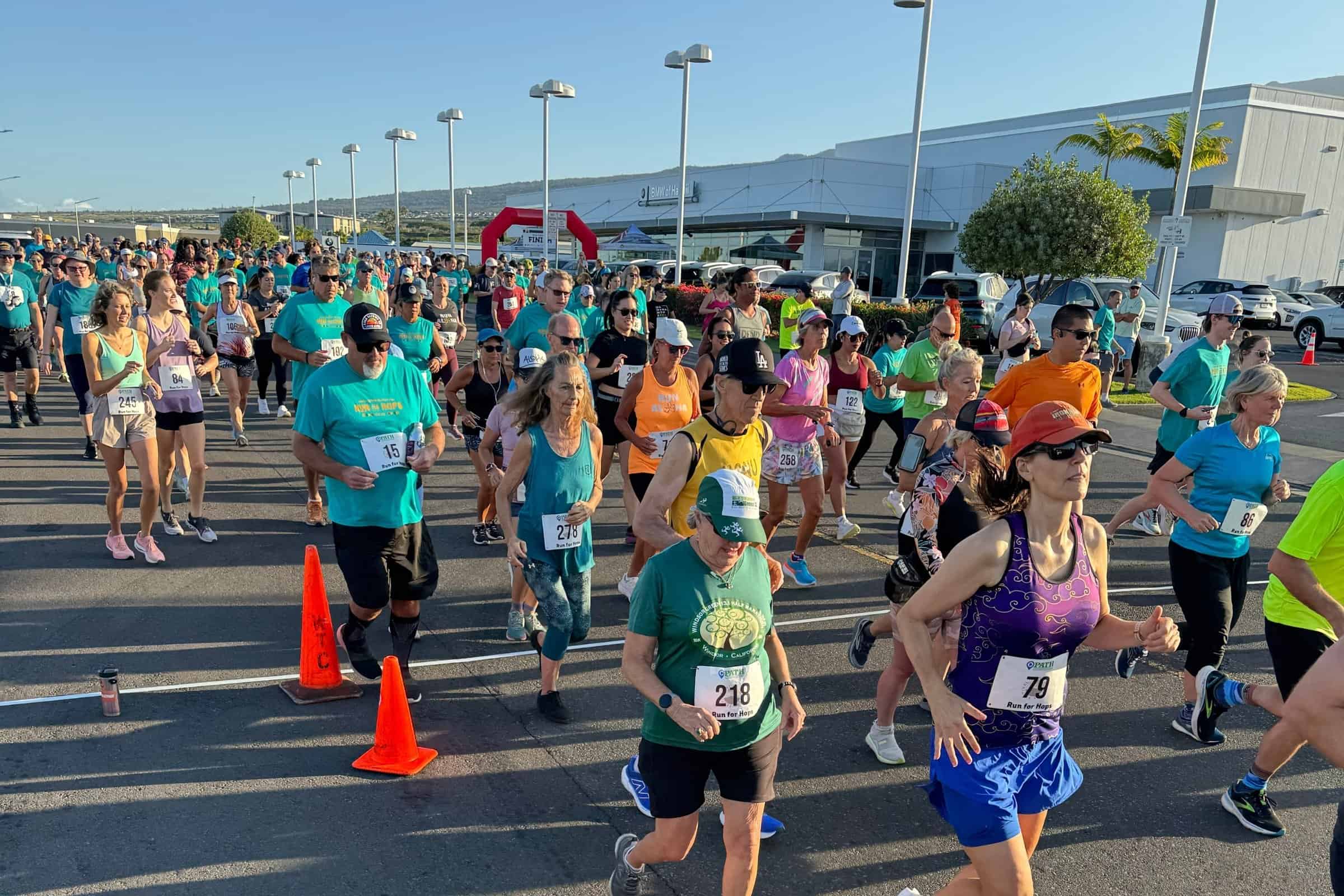 Field of runners heading out at the start of the Run For Hops 5K in Kailua-Kona.