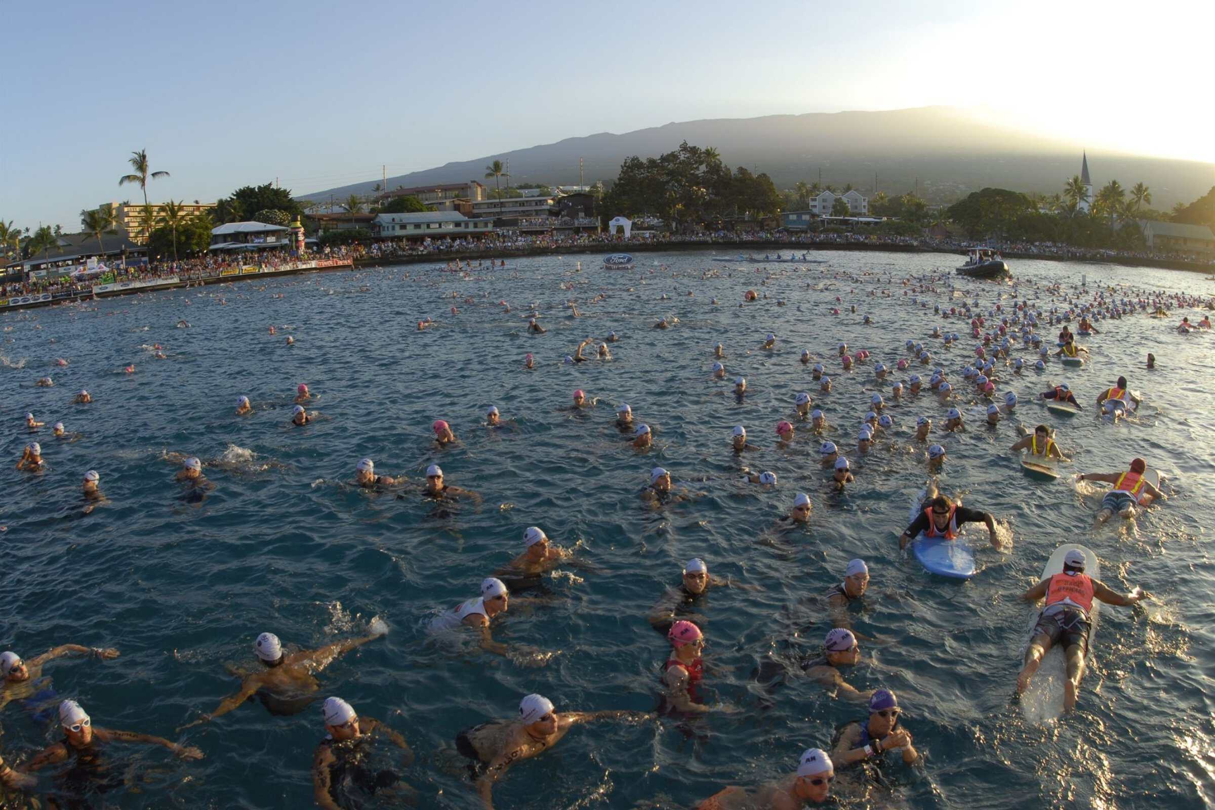 Wide view of the open water swim start spread across Kailua Bay below Historic Kailua Village.