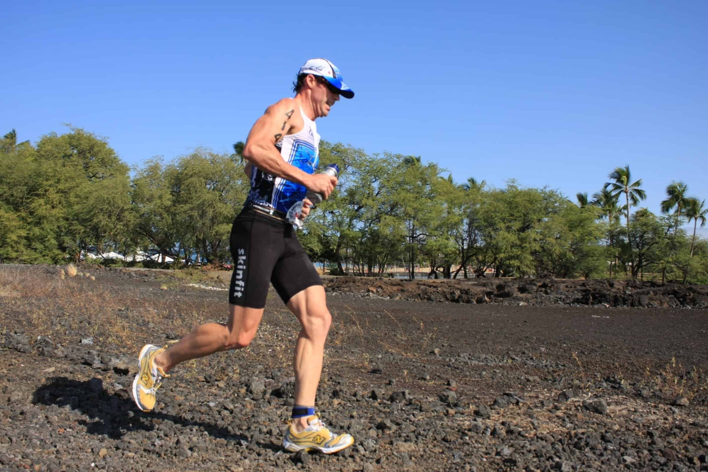 Penn Henderson running across the open lava fields during the Lavaman triathlon at Waikoloa.
